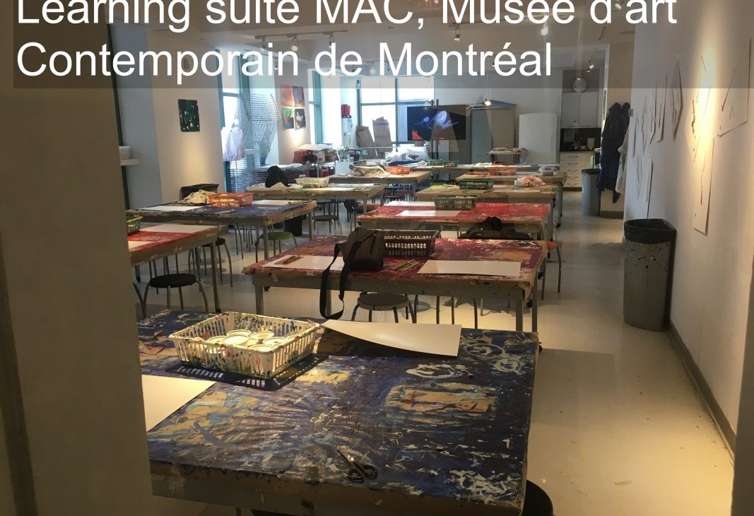 View into the Learning Suite at Musée d'art Contemporain de Montréal; work tables set up for a course