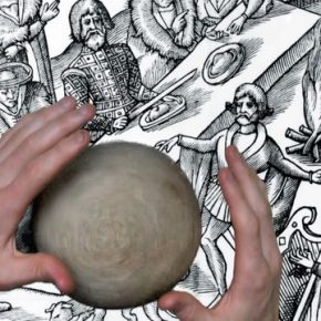 View down onto two hands working with a ball of clay on top of a historic black and white illustration.
