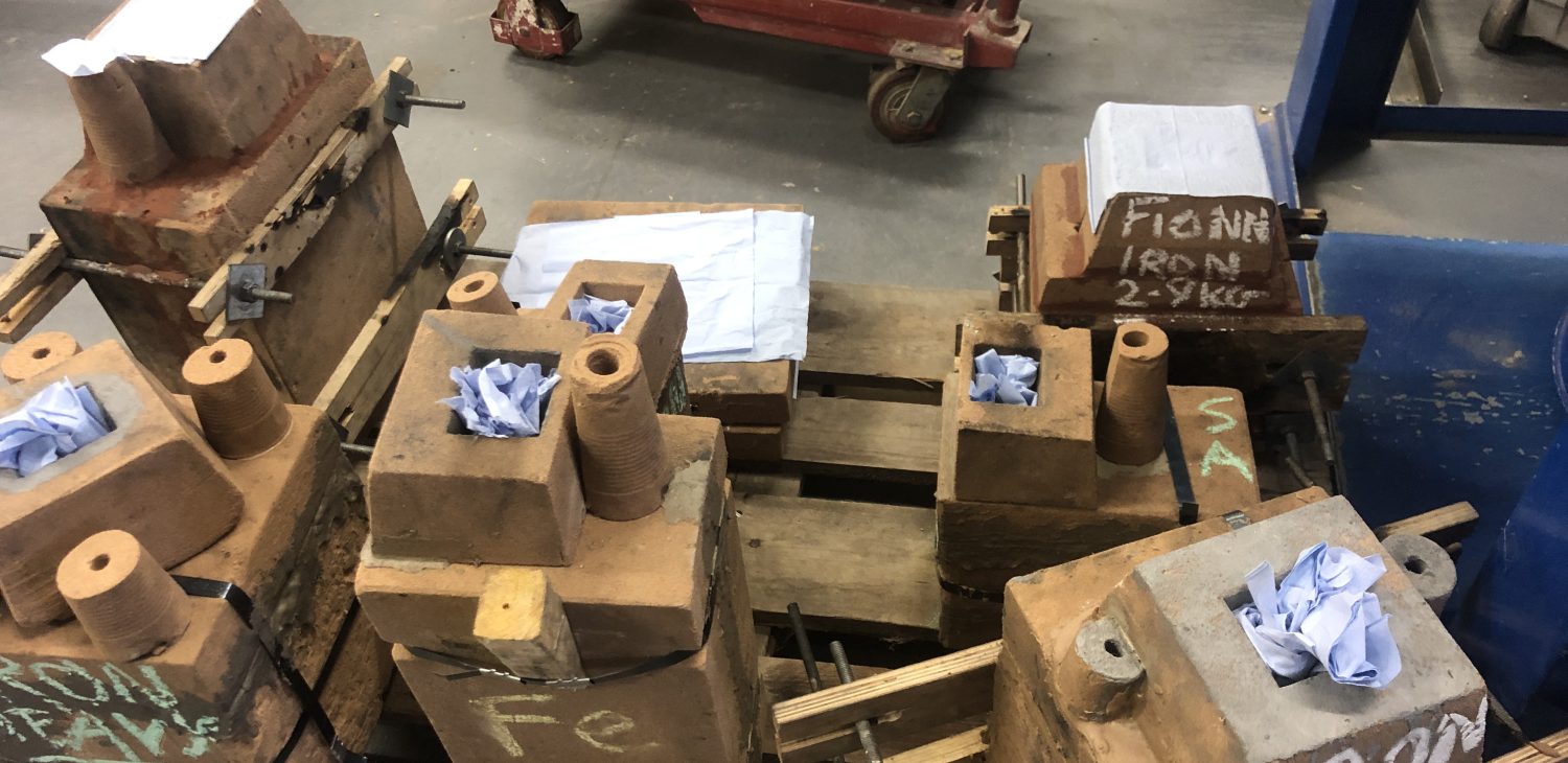 Sand moulds in the sand pit ready for pouring, Alternative Foundry Practices.