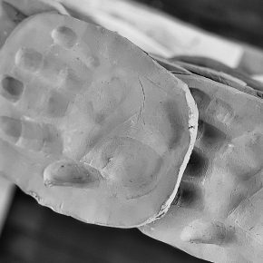 Hand imprints within clay made during a project with Iman Tajik.